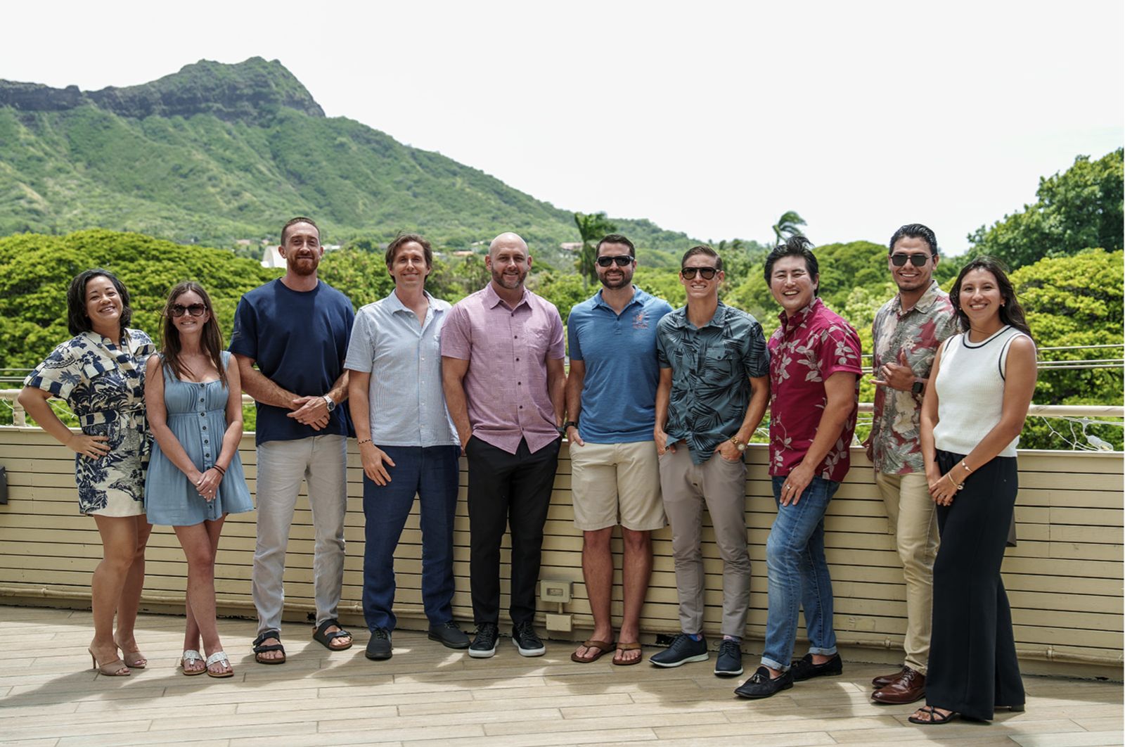 The Kama'aina Mortgage Group team on a lanai below Diamond Head, Honolulu